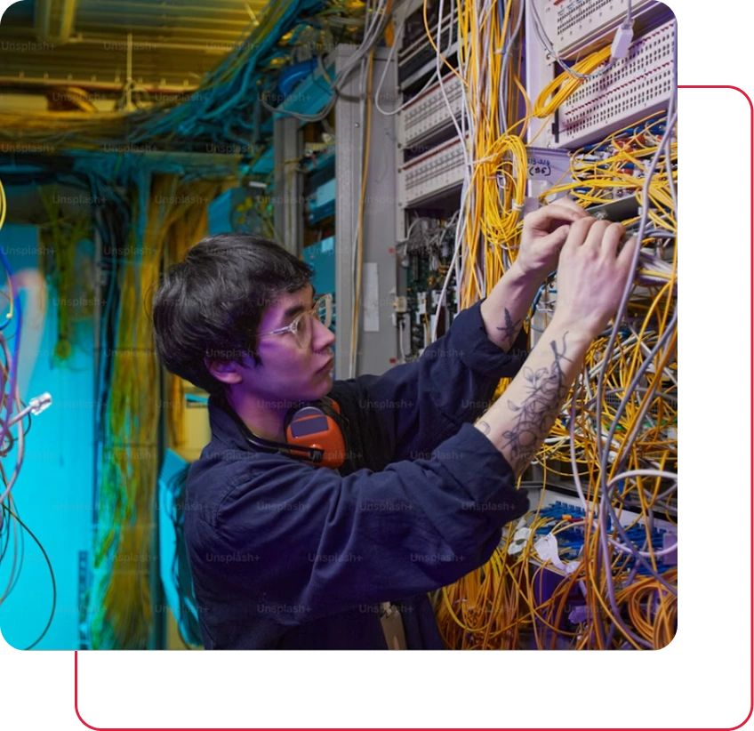 Engineer organizing server wires